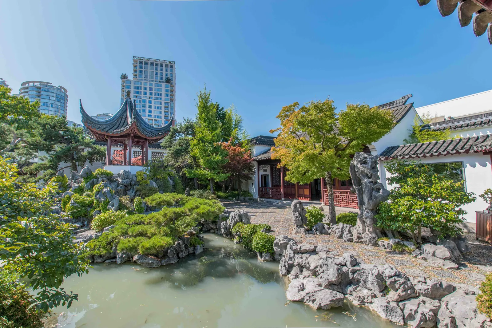 Classical garden architecture and serene pathways.